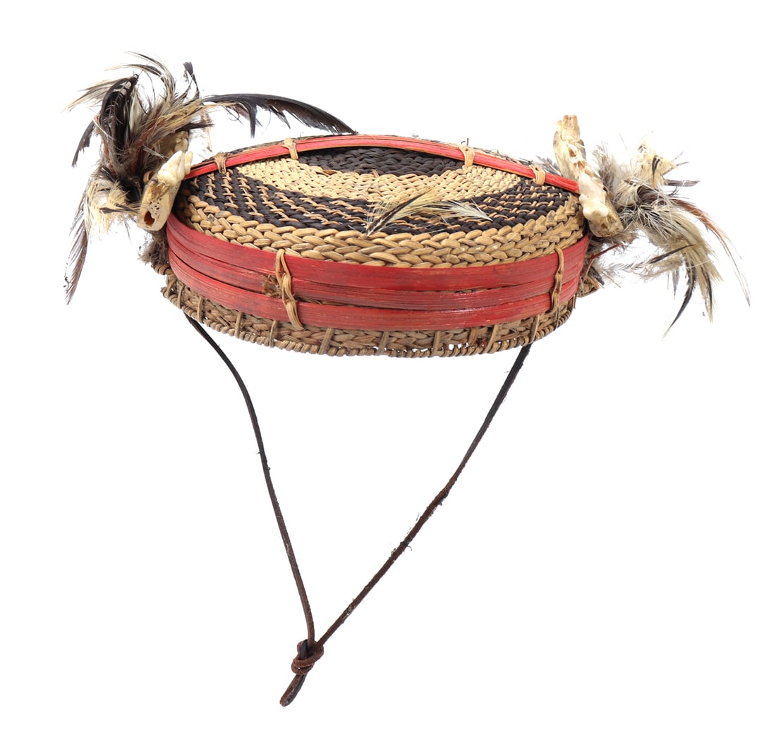 Filipino Suklang Bachelor's Hat: Finely crafted rattan and bamboo Filipino bachelor's hat. Adorned with feathers, animal jaw and teeth, reinforced by bamboo with a lovely red pigment. Hat is finely braided with light brown and dark