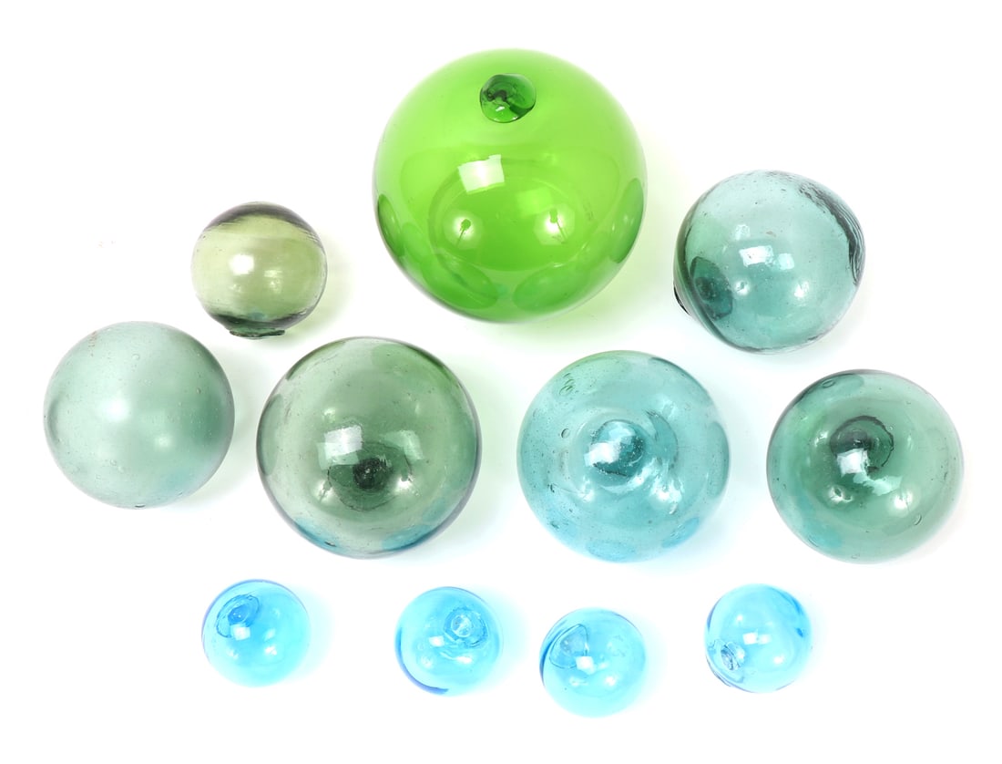 Eleven WWII Era Fishing Buoy & Floats: One large green buoy with light blue and green smaller buoy's. Four light blue floats. All hand crafted from blown glass, died for the fisherman to see but not distract fish. Size of largest 6" W,