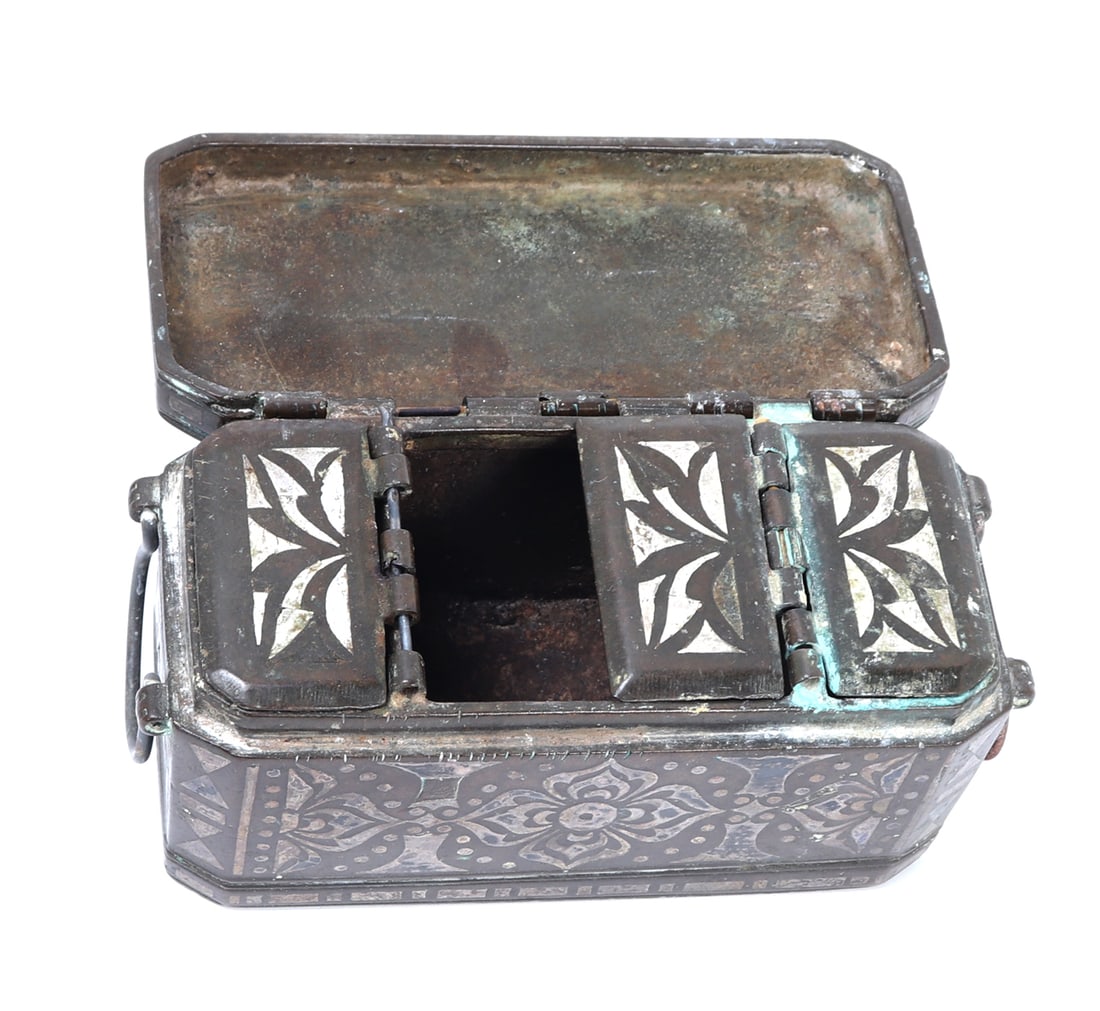 Philippines Moro Silver Inlay Betel Nut Box: Mindanao Filipino Moro silver inlayed brass betel nut box. The handcrafted box has intricately detailed panels of silver inlay to the outside as well as cover flaps. Piece still retains two handles