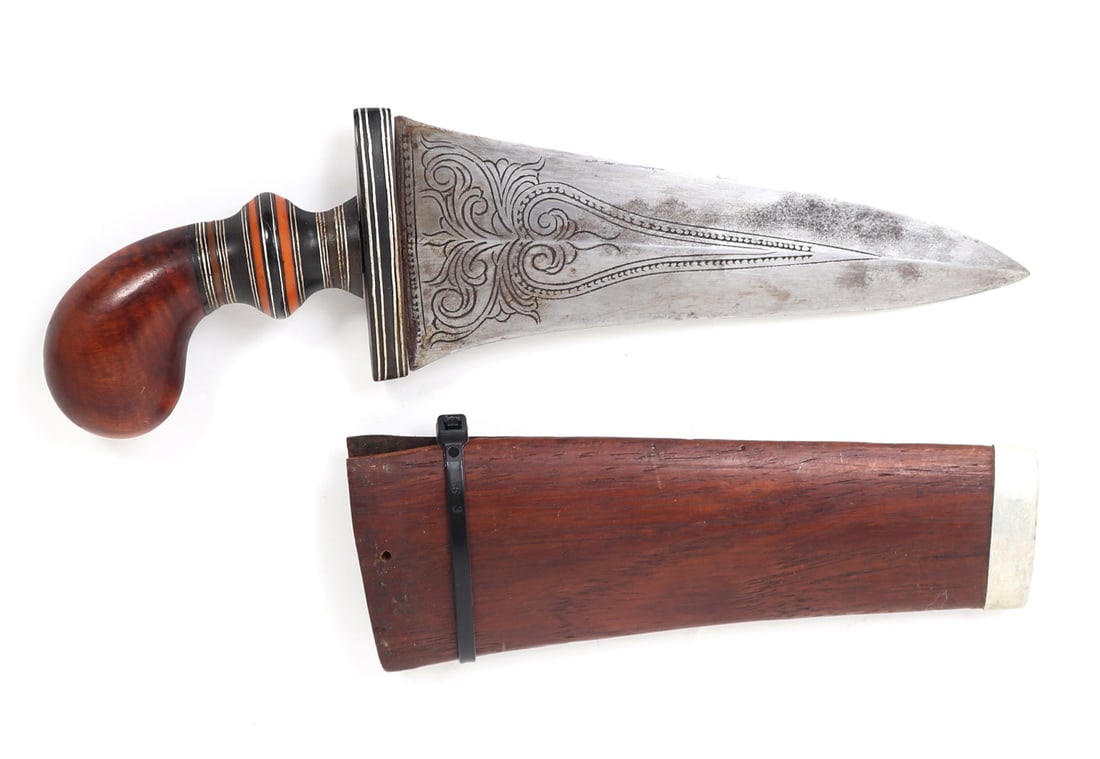 Fine Moro Punal or Gunong Dagger w/ Scabbard: Southeast Asia, Philippines archipelagos. Mindanao Moro Gunong Dagger with scabbard. Pommel in a polished brown wood with a beautiful layered mosaic grip of brown, orange, white, and black layers.