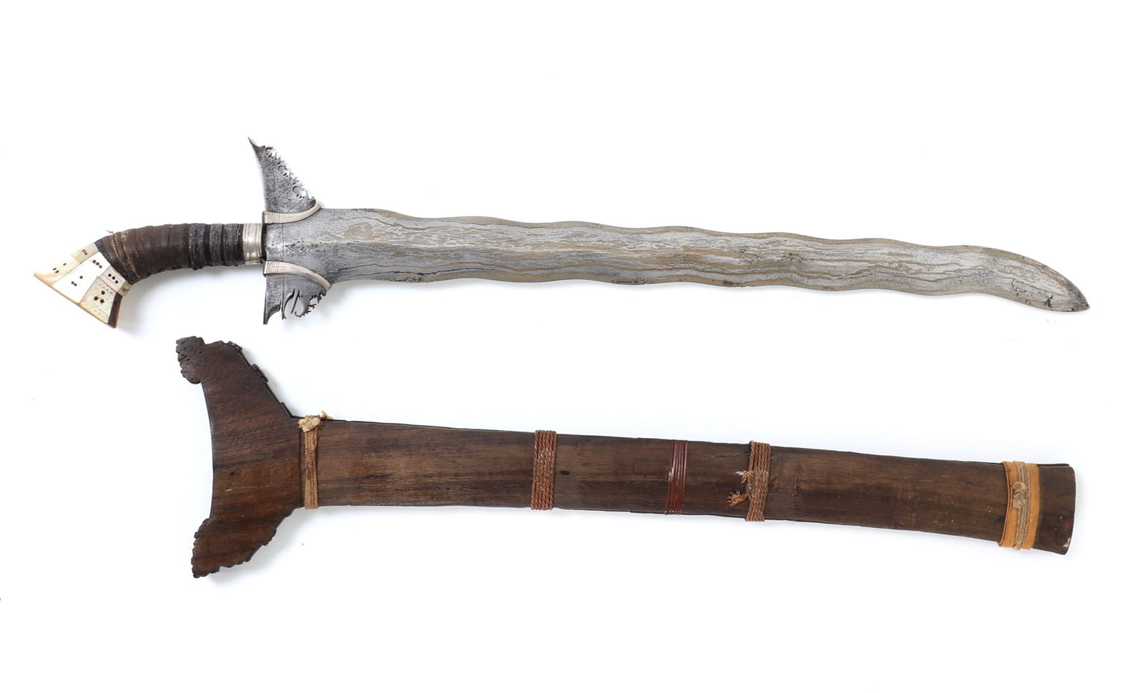 Fine 13 Wave Moro Sulu Kris with Scabbard: Late 19th to early 20th century, Sulu Archipelago, Southern Philippines. Wonderful hand crafted Filipino thirteen wave kris with wood scabbard, handle inlayed with mother of pearl expertly wrapped in