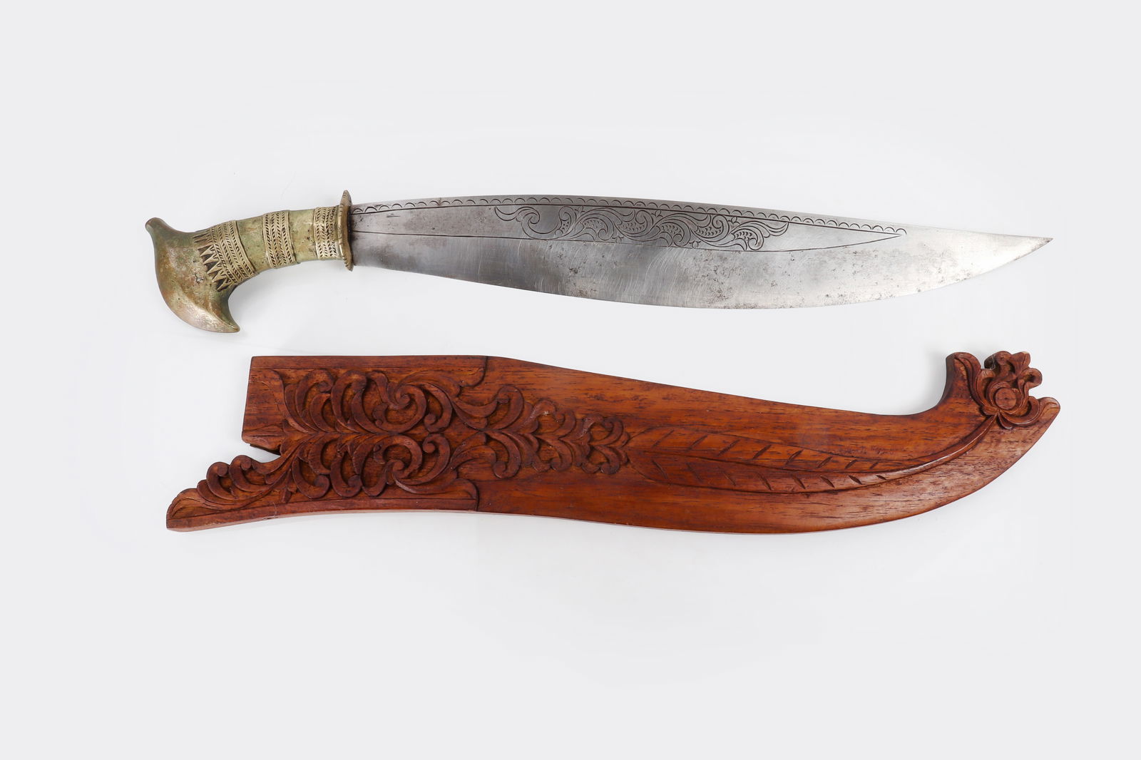 Ornate Mindanao Lumad Barong Sword, Early 20th C.: Ornate engraved Mindanao Lumad Tribes T'Boli Tok or Tolang Sword with scabbard. Handle in finely gilt brass casting with ornate bands and designs. Blade a large single edge with deep engraving and