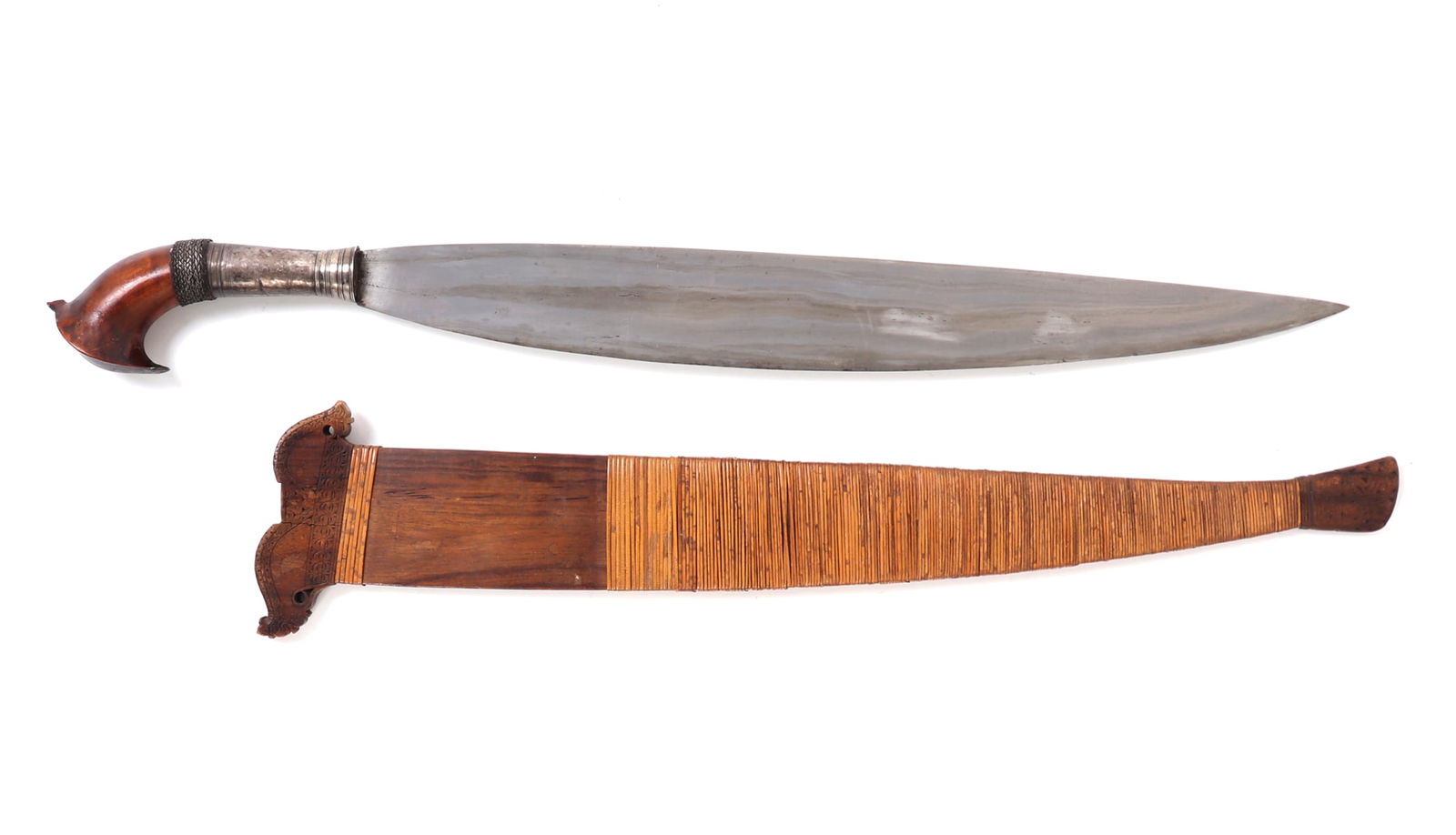 Philippines Barong Sword w/ Scabbard: Filipino barong sword with rattan wrapped wooden scabbard. Blade of typical leaf form with single edge. Metal handle secured with braided metal ring leading to wooden kakatua form pommel. Based of woo