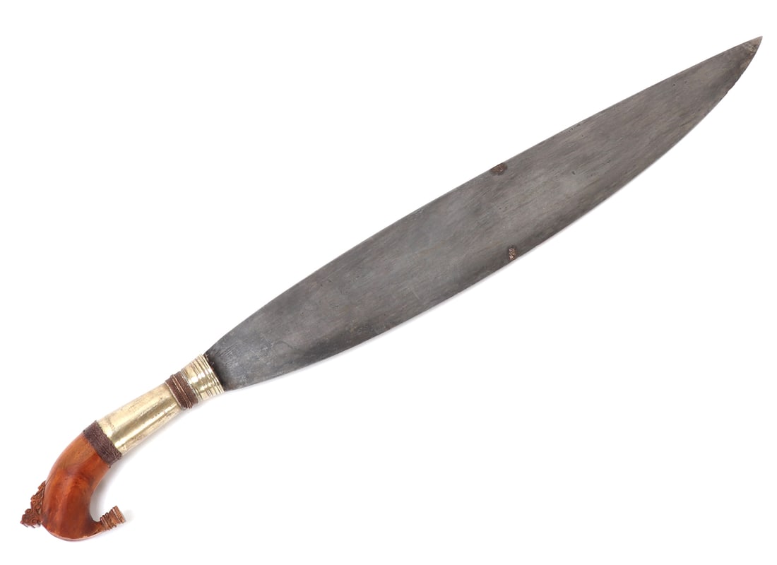 Philippines Moro Barong Sword: Filipino Moro barong sword with kakatua wood pommel. Leaf shaped blade terminates into a ribbed metal collar. Metal handle with woven rattan bands to top and bottom. Kakatua wood pommel decorated with