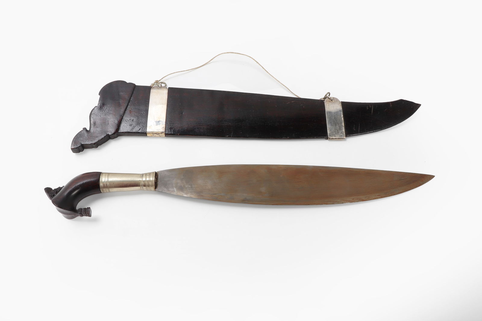 Silver Mounted Moro Barong, USSB: Excellent Moro Barong with silver mounts for display aboard a merchant marine vessel. Scabbard in a dark wood with two bands of silver for display on a wall. Typical leaf form blade with single edge.