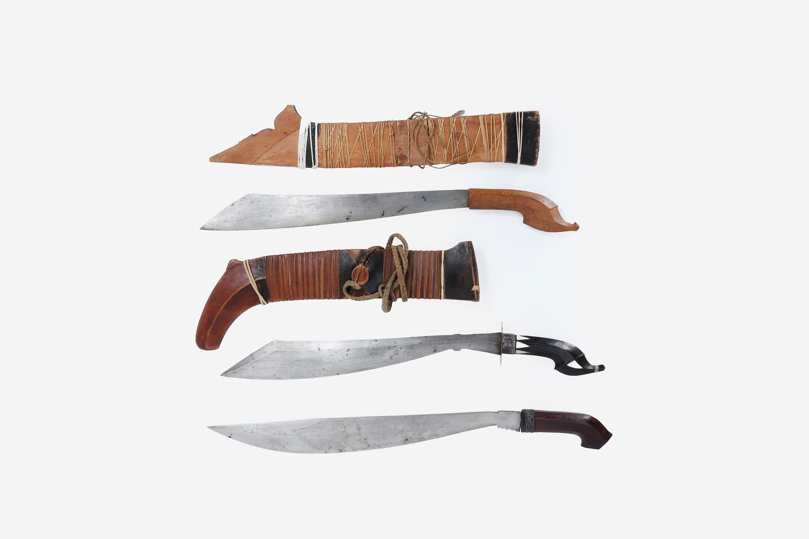 Lumad Tribes Mandaya Bolo, Mindanao: Collection of Old museum Philippines swords and scabbards. Mindanao Lumad Tribes Mandaya Bolo swords with carved wood handles. One example with light wood handle and included scabbard. Two remaining w