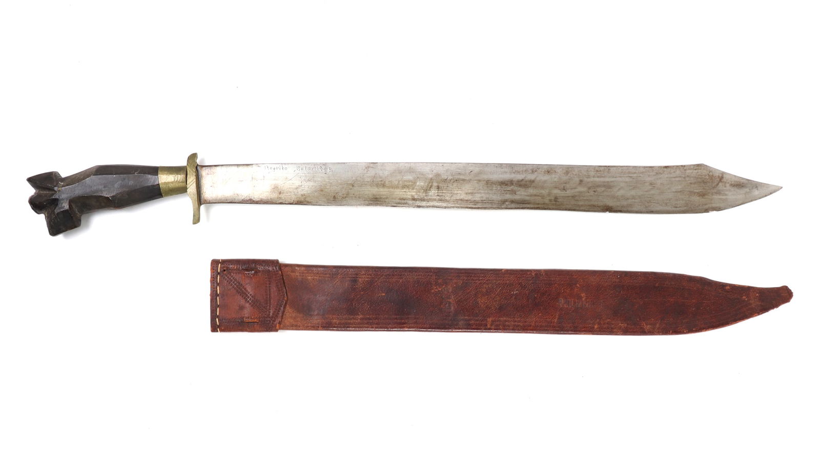 Negrito Bolo Sword & Scabbard, Inscribed 1968: Philippines Archipelagos, inscribed negrito bolo sword with scabbard circa 1968. Of typical form with a straight single edge blade with double edge point. Guard brass with light vertical engraving. Ca