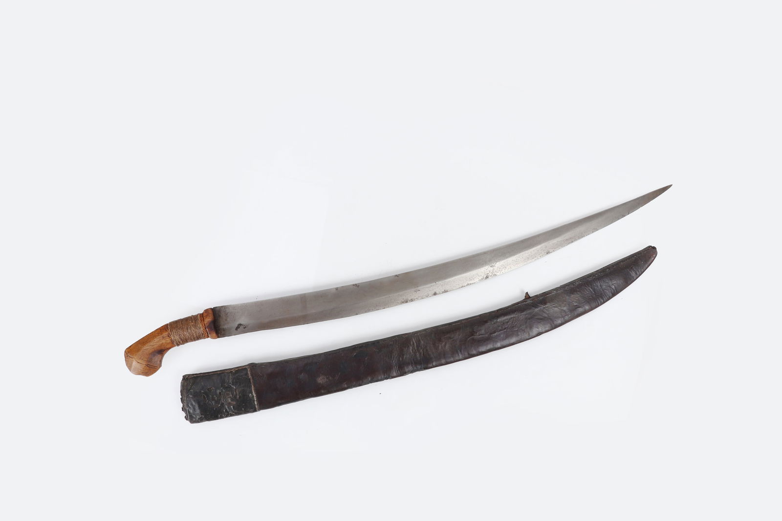 Visayan Sumar Sword & Sheath: Philippines, Visayan, Samar, Pulahanes peoples, Philippines revolution or insurrection period late 19th century. Samar Talibon sword with carabao hide sheath. Single edge curved blade with sharp