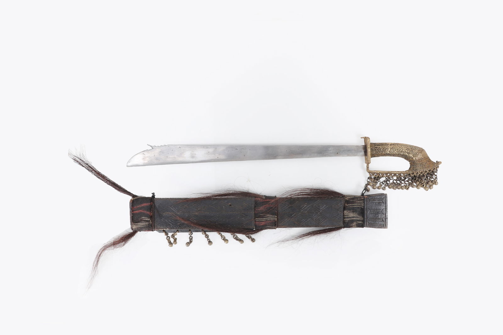 Mindanao Lumad Tribes T'Boli Tok or Tolang sword: Philippine Archipelagos, Mindanao, Lumad Tribes T'Boli Tok or Tolang sword and scabbard, early 20th century. Handle finely cast in brass with dangling bells on chain link. Blade a single edge straight