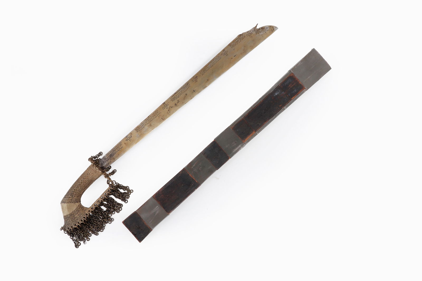 Mindanao T'Boli Sword, Lumad Tribes: Philippines, Mindanao, Lumad peoples first half of the 20th century. Overall length 26" T'Boli Tok / Tolang Sword with scabbard. Scabbard with metal bands over wood. Single edge blade with Kampilan st