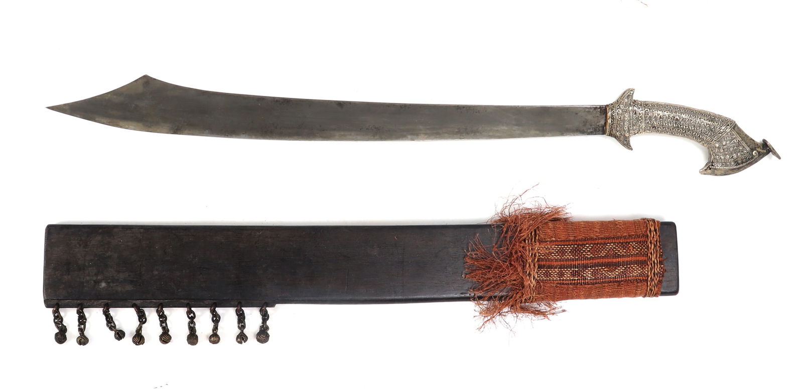 Rare Silver Gilt T'Boli Sword & 9-Bell Scabbard: Philippines Archipelagos, Southern Philippines, Mindanao Province, first half of the 20th century. Cockatoo handle and pommel in silvered brass with intricate patterns of scrolling motifs and bands. S