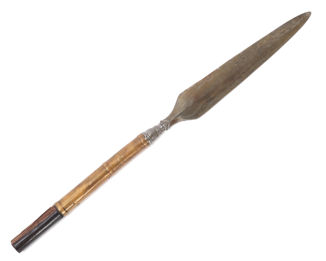Philippines Moro Spear: Philippines Moro spear head with brass sleeve covering the spear shaft. Spear head is double edged with ribbed section above tang. Brass sleave decorated with concentric rings. Nice example. Size 19