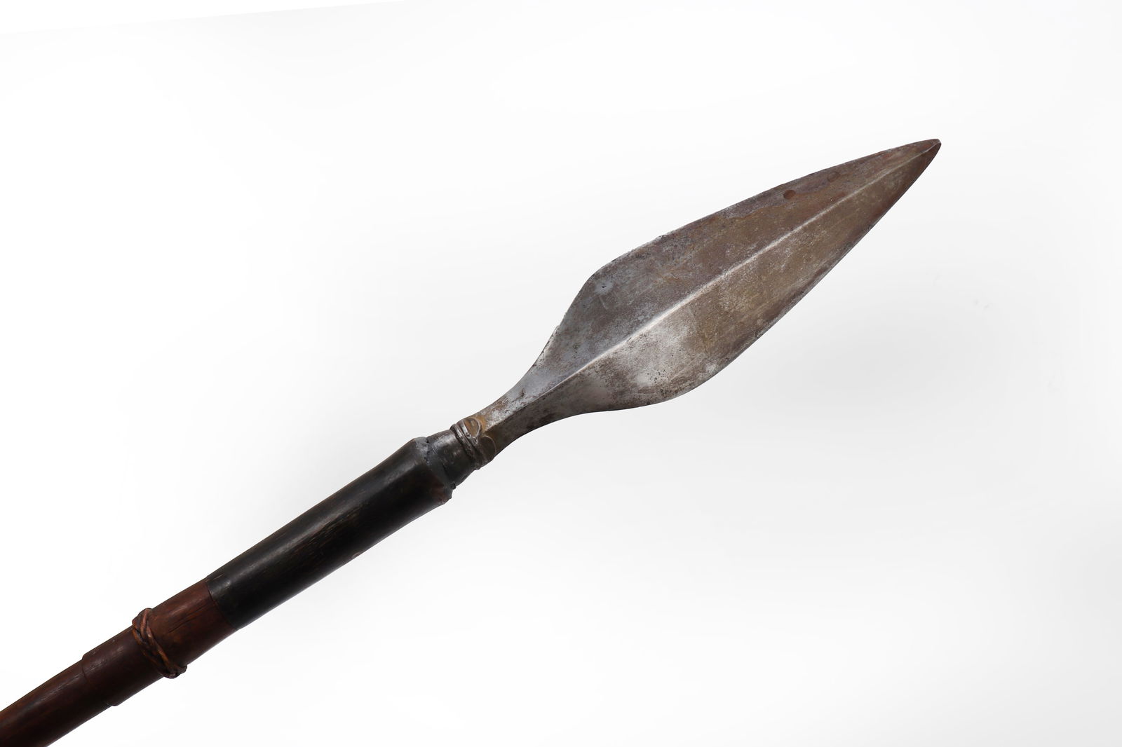 Philippines Moro Tausug Spear: Philippines Moro Tausug Spear with original shaft, carabao horn sleeve, and rattan wrapping. 19th century. Beautiful spear head with diamond cross section and broad leaf double edge blade with