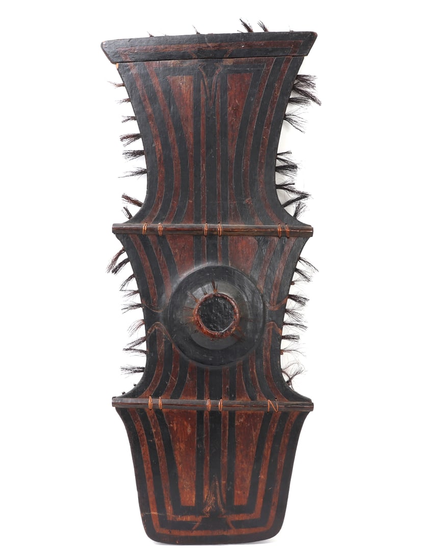 19th/20th C. Excellent Rare Bagobo Klong Wood Shield: Rare 19th/20th century Mindanao highlands, Philippine Bagobo peoples hand made wooden shield. Impressive shields main body is one solid piece of wood with an added ledge piece at the top. Four