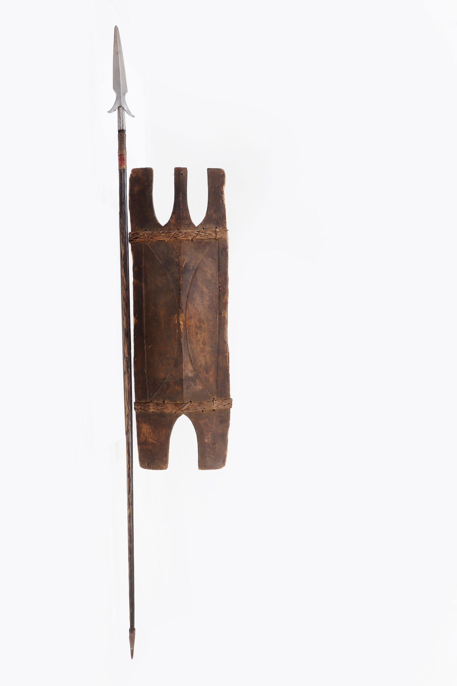 Ifugao Sheild & Long Spear Set: Ifugao Igorot Shield and spear with bloodred Red rattan wrapped scabbard, 19th century. Spear overall 6' long that breaks down into two pieces with original spiked base. Great early set with excellent