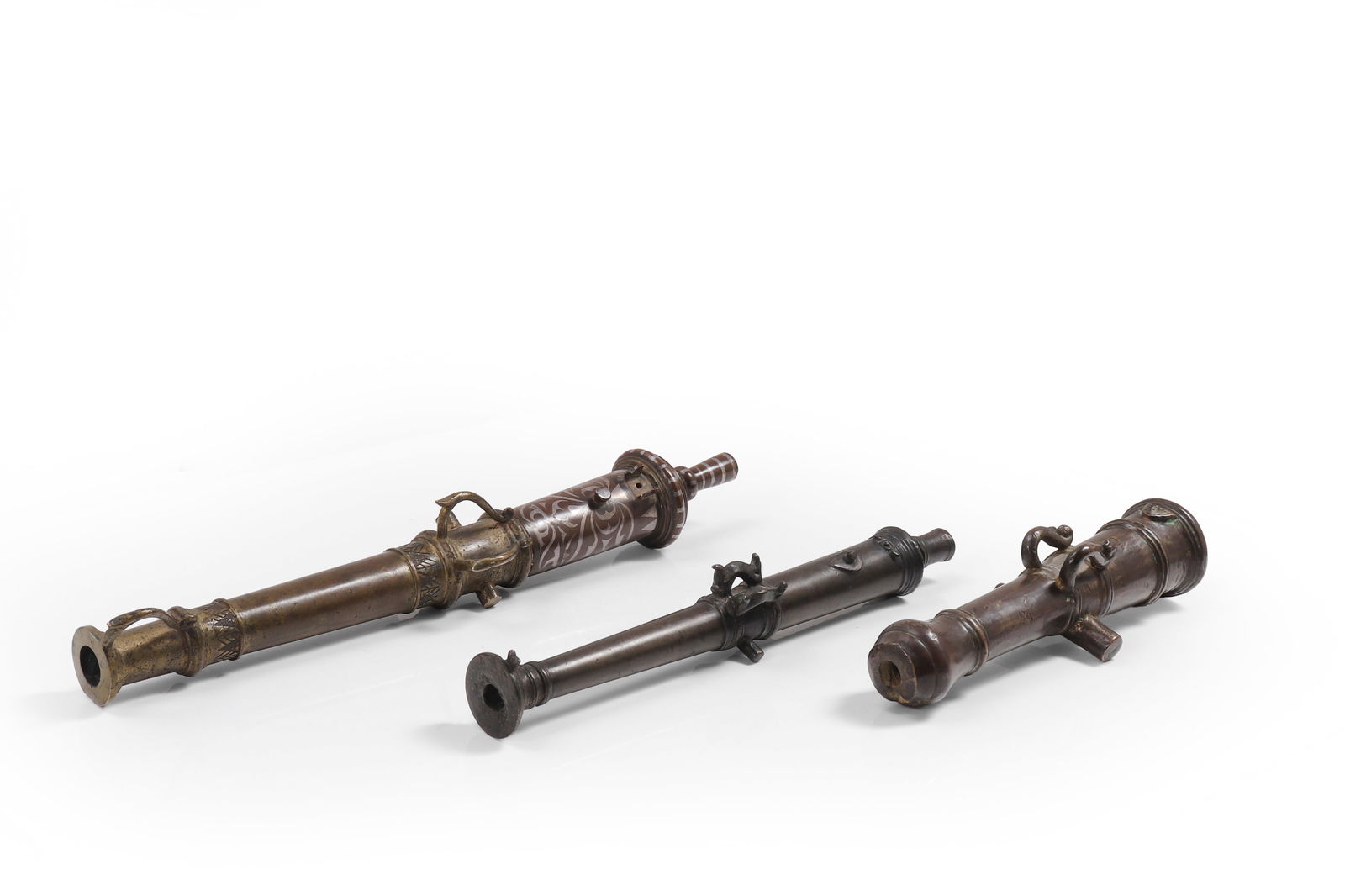 Miniature Philippine Cannons, 18th Century: A fantastic collection Philippines Moro cannons of the late 18th - 19th century of the period and use. Right most a very small bronze cannon with trunnion and bulbous barrel breach, an excellent minia