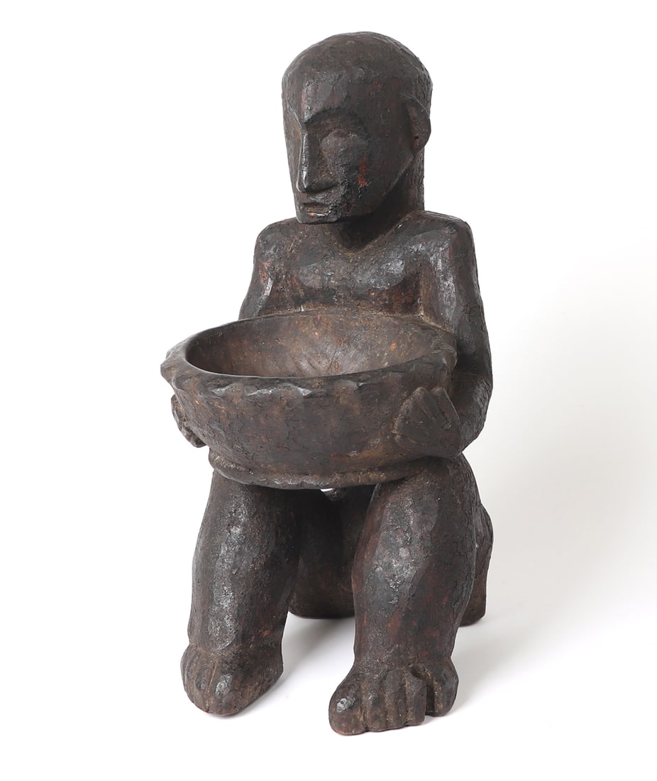 Philippine Bulul Statue Offering Bowl, Ex-Joaquin Palencia Collection: Tall Philippines Bulul statue clasping bowl from the Cordillera region of Luzon and dating from at least the 1st quarter of the 20th century. Fine bowls used in rituals hold a special place as some