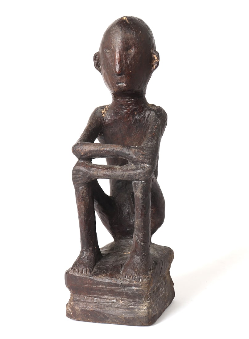 Philippines Bulul Figure, Ifugao circa 1900-1925: Philippines Bulul seated figure from the Ifugao region and peoples a remarkably stylistic and medium-sized Bulul sculpture. Its design highly stylized, characterized by robust, flat backs,