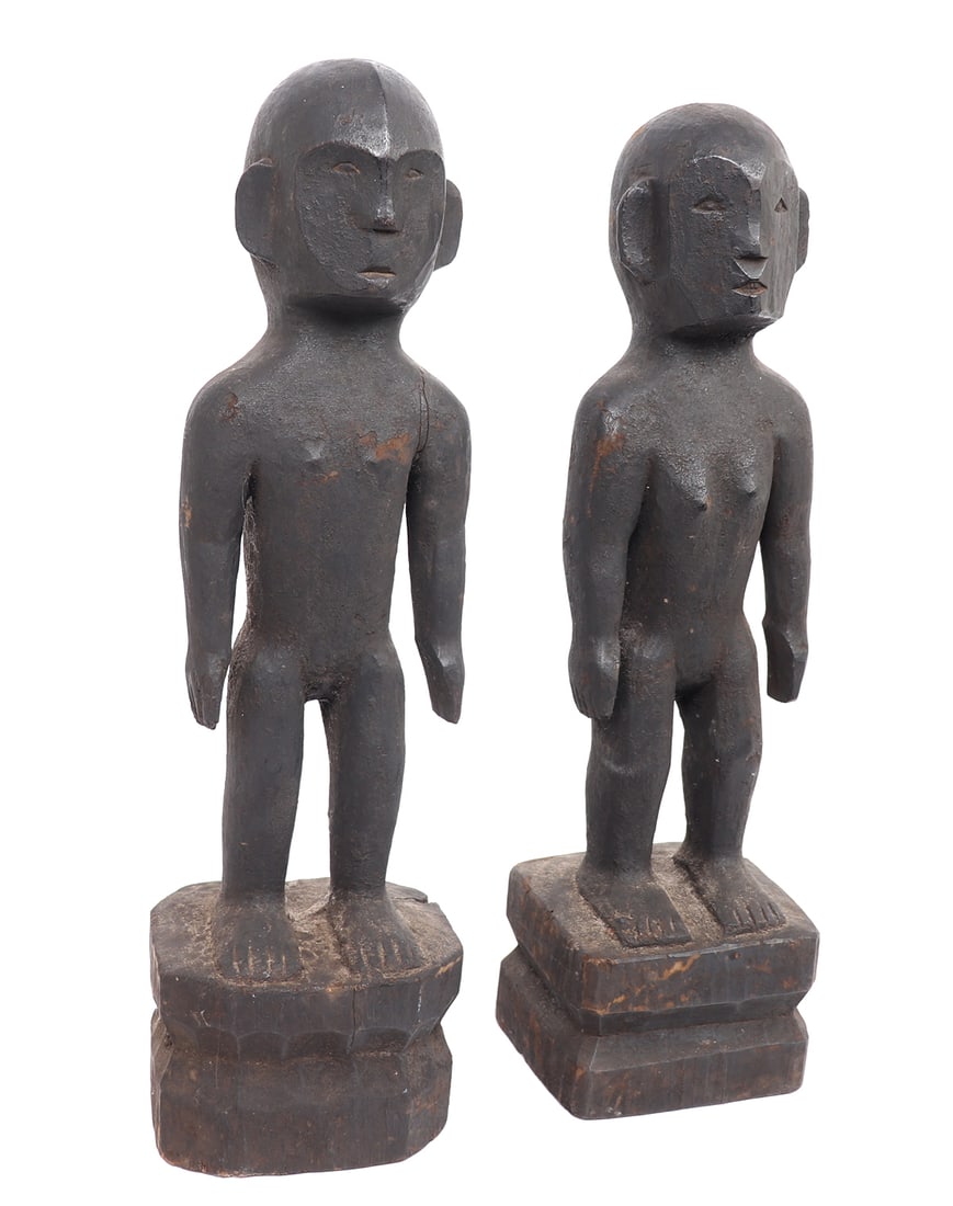 Pair of Philippine Ifugao Bulul: These Philippine sculptures, originating from the Lagawe Region of Ifugao, exemplify a distinctive primitive canonical style. Their semi-heart shape faces adorned with elements of indigenous art,