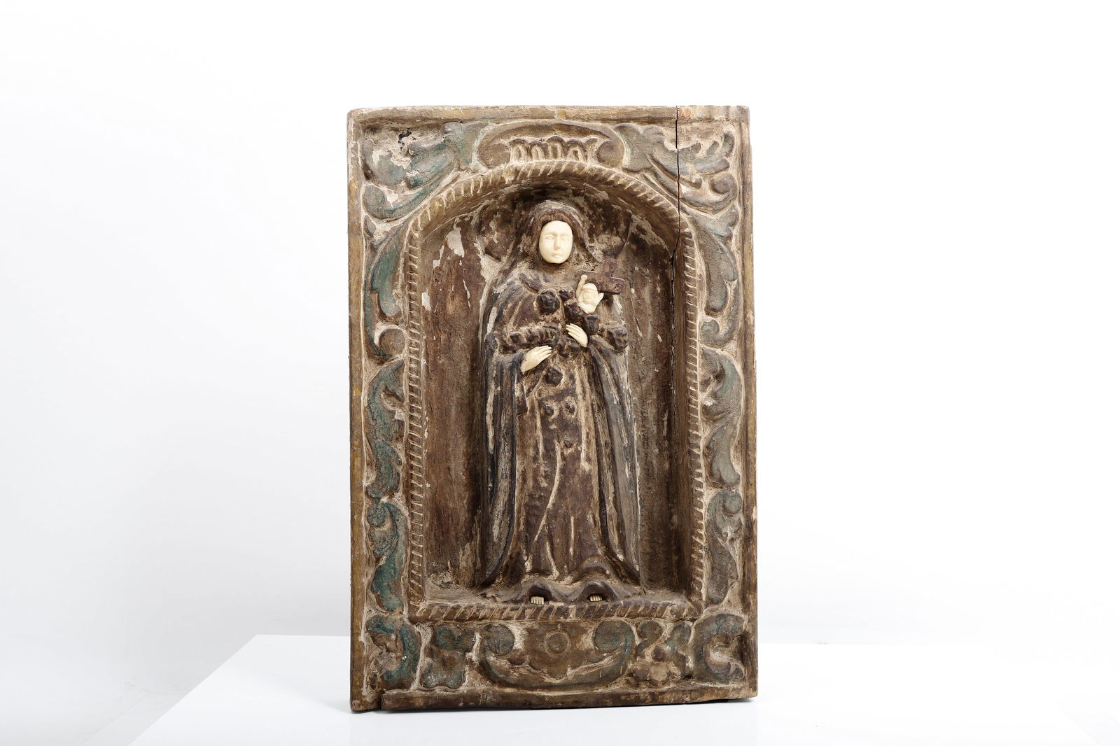 POLYCHROMED WOOD PANEL OF THE MADONNA & CHILD, Philippine Archipelago, Late 18th Century: Thickly carved wooden devotional panel depicting the Madonna and Child in mid- to high-relief, the figures set within a recessed field. The Virgin shown frontally supporting the Christ Child upon her
