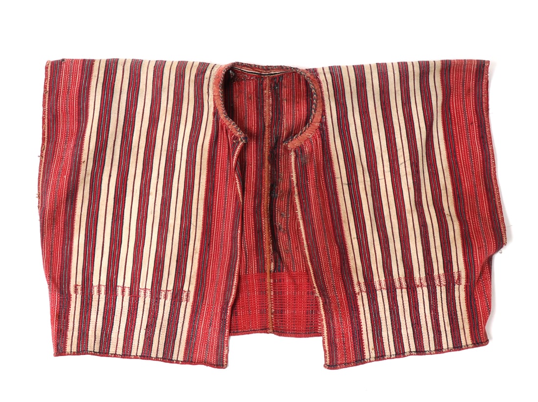 19th C. Philippines North Textile Vest: Philippines Archipelagos, North Philippines, Ifugao / Yakan vest, 19th century abaca fabric with a finely stitched multicolored collar and patterns of red, white, and black vertical stripes. Designed