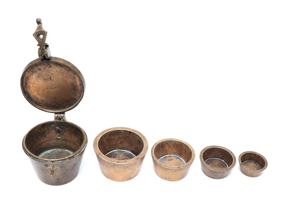 Spanish Apothecary Onzas Measure Set, 18th - 19th c.: Iberian Peninsula, Spanish bronze apothecary weight measure set, late 18th or early 19th century. Reading "Libras" to the top of the largest and interior lid. Each reading from 8 onzas to 1 onzas.