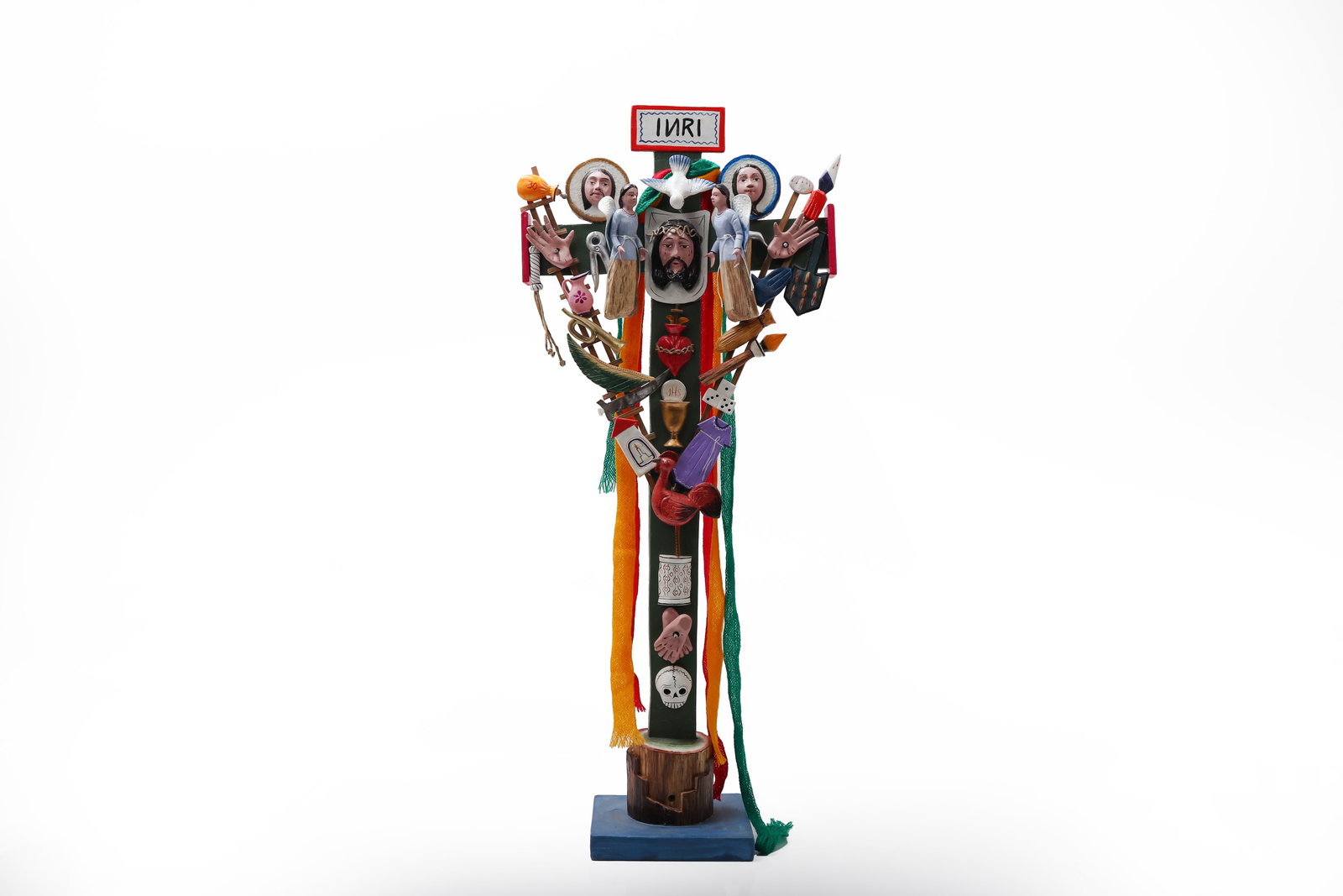 Peruvian Folk Art Arma Christi Cross: Vibrant carved and polychromed Peruvian folk art devotional cross, richly adorned with symbolic elements associated with the Arma Christi, or Instruments of the Passion. The black-painted cross is emb