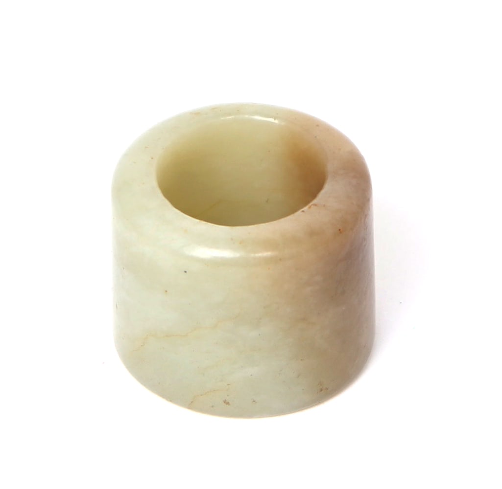 Early Chinese Jade Archers Ring: Finely carved and polished Chinese jade archers ring. These types of rings were used as a thumb ring essential both to protect the thumb and to ensure a smooth release of the arrow. Size 7/8" H, 1" W
