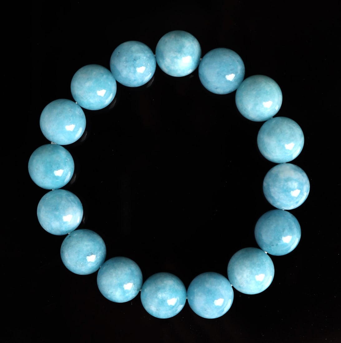 Lovely Aquamarine Beaded Bracelet: Gorgeous aquamarine beads strung in a lovely bracelet. Each bead with a lovely cloud like marbling throughout. Size 7" L