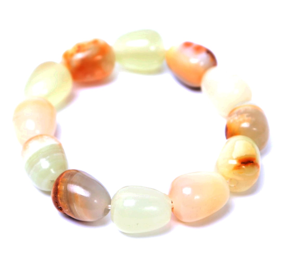 Agate Stone Polished Bead Bracelet: Lovely set of polished agate stone beads in varying colors from deep brown, lovely green and yellow coloring throughout. Size 2 3/4" W opening, elastic