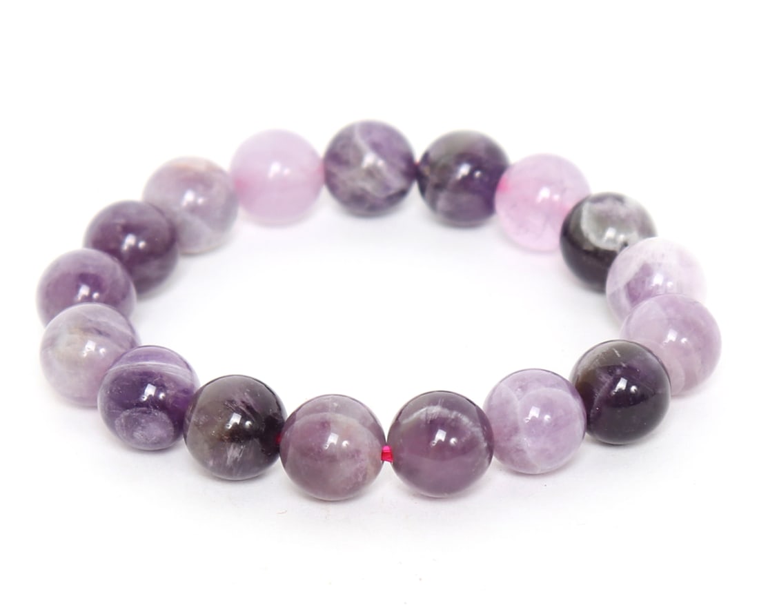Lovely Amethyst Bead Bracelet: Gorgeous deep purple crystal amethyst beaded bracelet including seventeen perfectly polished beads throughout. Ranging from a lovely lilac to a deep spectacular purple this bracelet makes for a