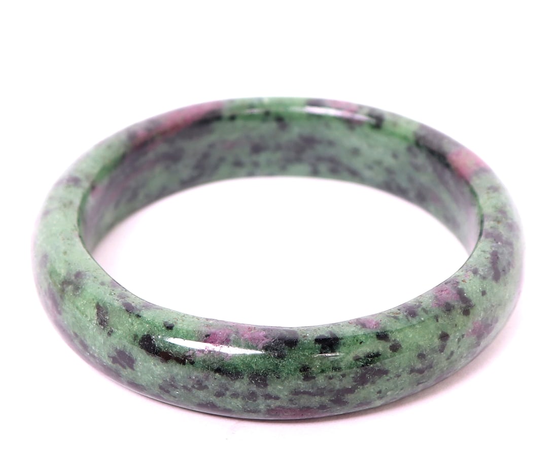 Stunning Natural Ruby Polished Bangle Bracelet: Gorgeous natural ruby specimen polished into a lovely wearable bangle bracelet with incredible coloring throughout. Deep ocean green to a like violet/pink color. Gorgeous crystal inclusions