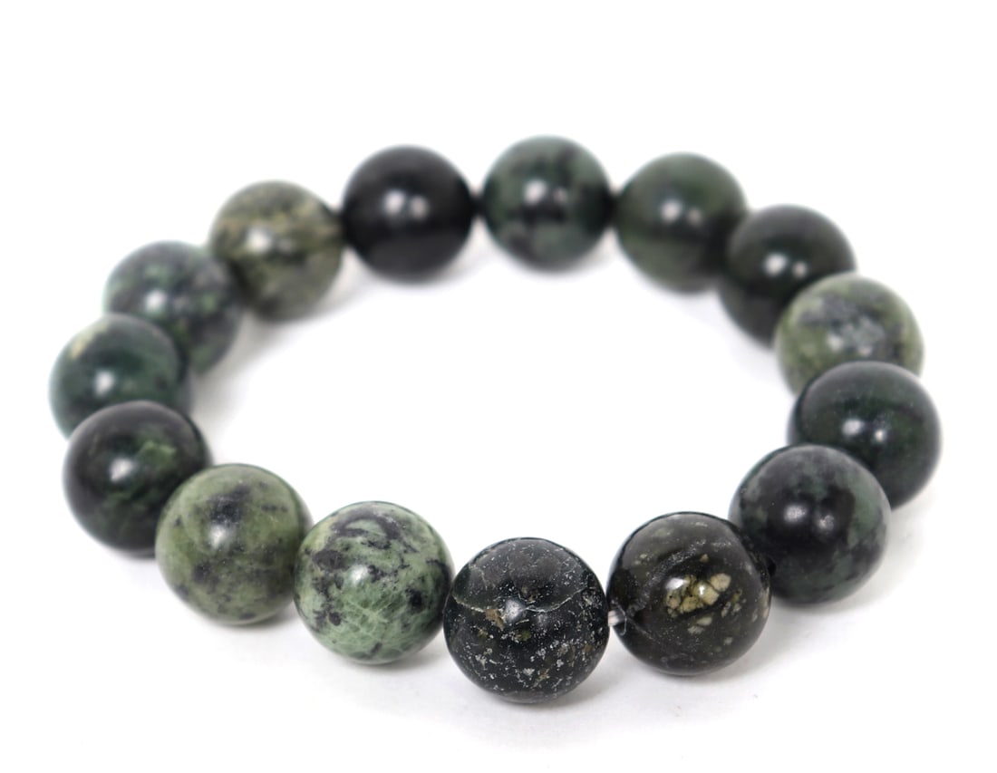Stunning Polished Natural Jasper Bracelet: Lovely natural galaxy burst green jasper polished bead bracelet comprised of fifteen unique incredible soft polished beads. Size 3" W elastic