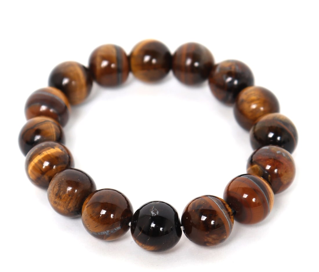 Gorgeous Tigers Eye Beaded Bracelet: Sixteen beautifully polished tiger eye beaded bracelet, with deep caramel, chocolate and gold banding throughout. Size 3" W elastic