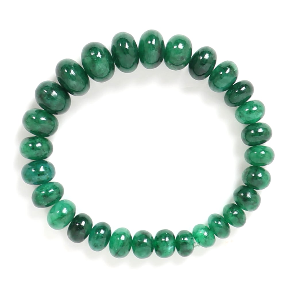 Gorgeous Dyed Emerald Green Quartz Bracelet: Wonderful emerald green dyed quartz beaded bracelet with oblong shaped beads in a varied series of sizes from small to wide giving a crown like illusion. Size 2" W opening, elastic