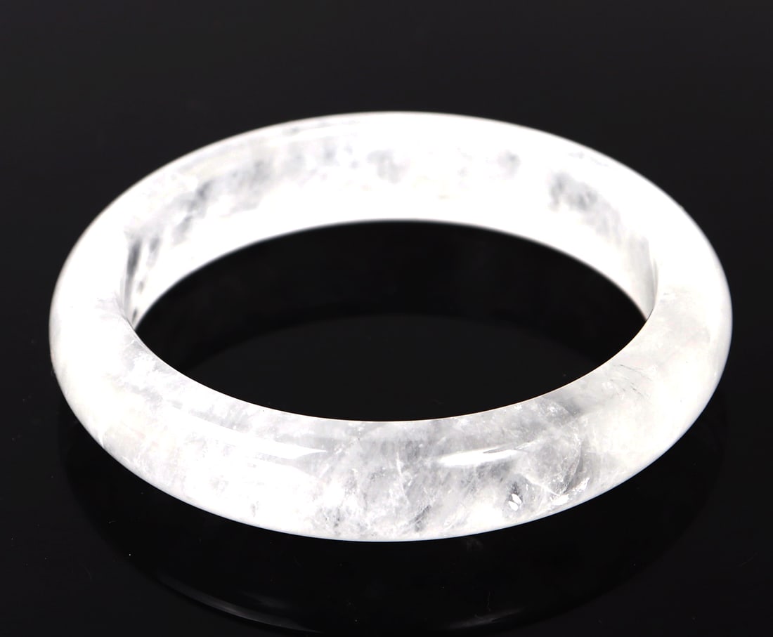 Gorgeous Rock Crystal Polished Bangle Bracelet: Perfectly polished and shaped raw rock crystal bangle bracelet. Like and cold to the touch but extremely sturdy. Among many other wonderful properties, rock crystal is known to promote healing and