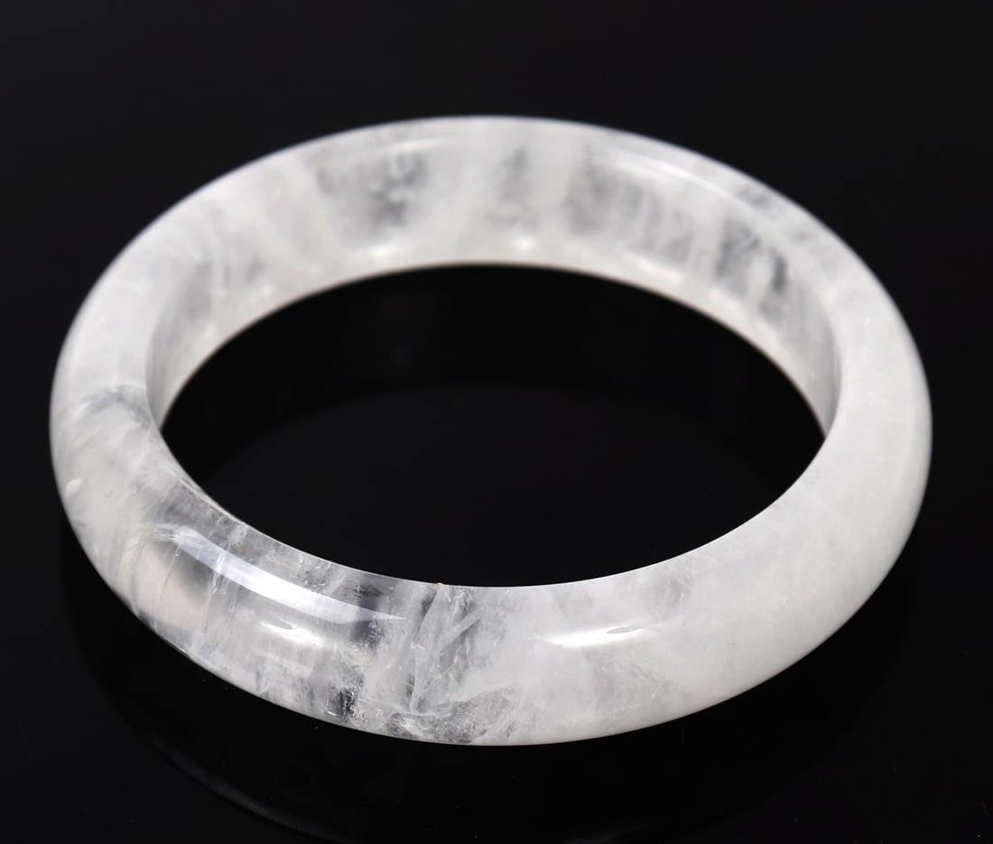 Beautiful Rock Crystal Bangle Bracelet: Wonderful care went into the forming of this gorgeous rock crystal bangle bracelet. Marvelous crystal inclusions and veining throughout. Size 3 1/2" L x 3 1/2" W x 1/2" H, weight 56 grams