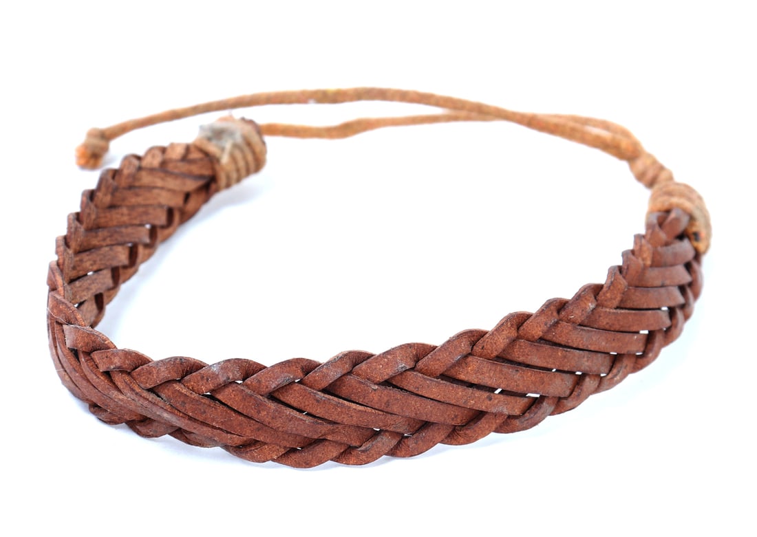 Finely Braided Leather Bracelet: Hand braided and treated animal hide leather bracelet. Warm maple syrup wood colored leather with pull slip clasp for wearing. Size 4 1/2" L