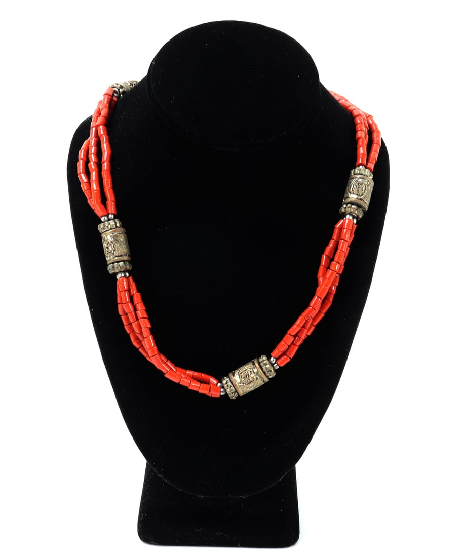 Gorgeous Tibetan Coral & Beaded Necklace: Gorgeous triple stranded necklace comprised of beautiful bright red coral beads with hand crafted copper or brass hammered tube beads. The tube beads have beautiful hand hammered flowers throughout.