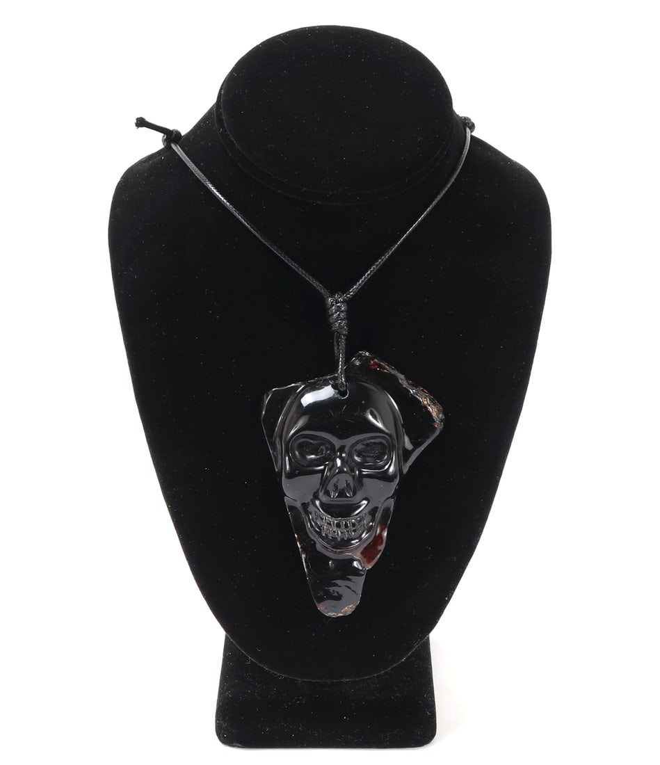 Gorgeous Skull Carved Amber Pendant Necklace: Lovely amber mineral specimen carved and polished into a menacing skull pendant on an adjustable cord. Size 19" L, pendant 3 3/4" L
