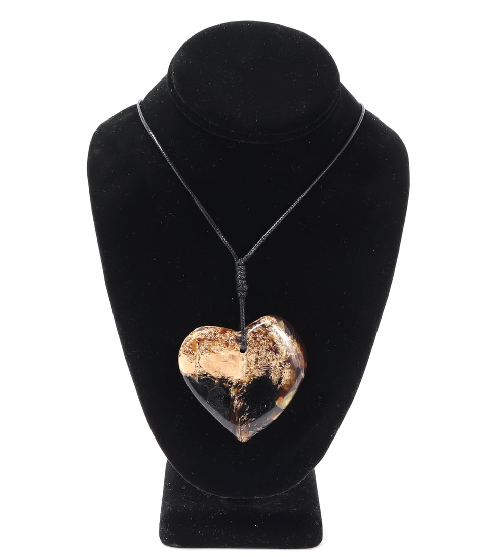 Gorgeous Heart Shaped Natural Raw Amber Necklace: Gorgeous all natural amber mineral specimen with incredible cream and crystal inclusions throughout. Heart pendant slightly misshapen with a lovely translucency throughout. Drilled to the top with