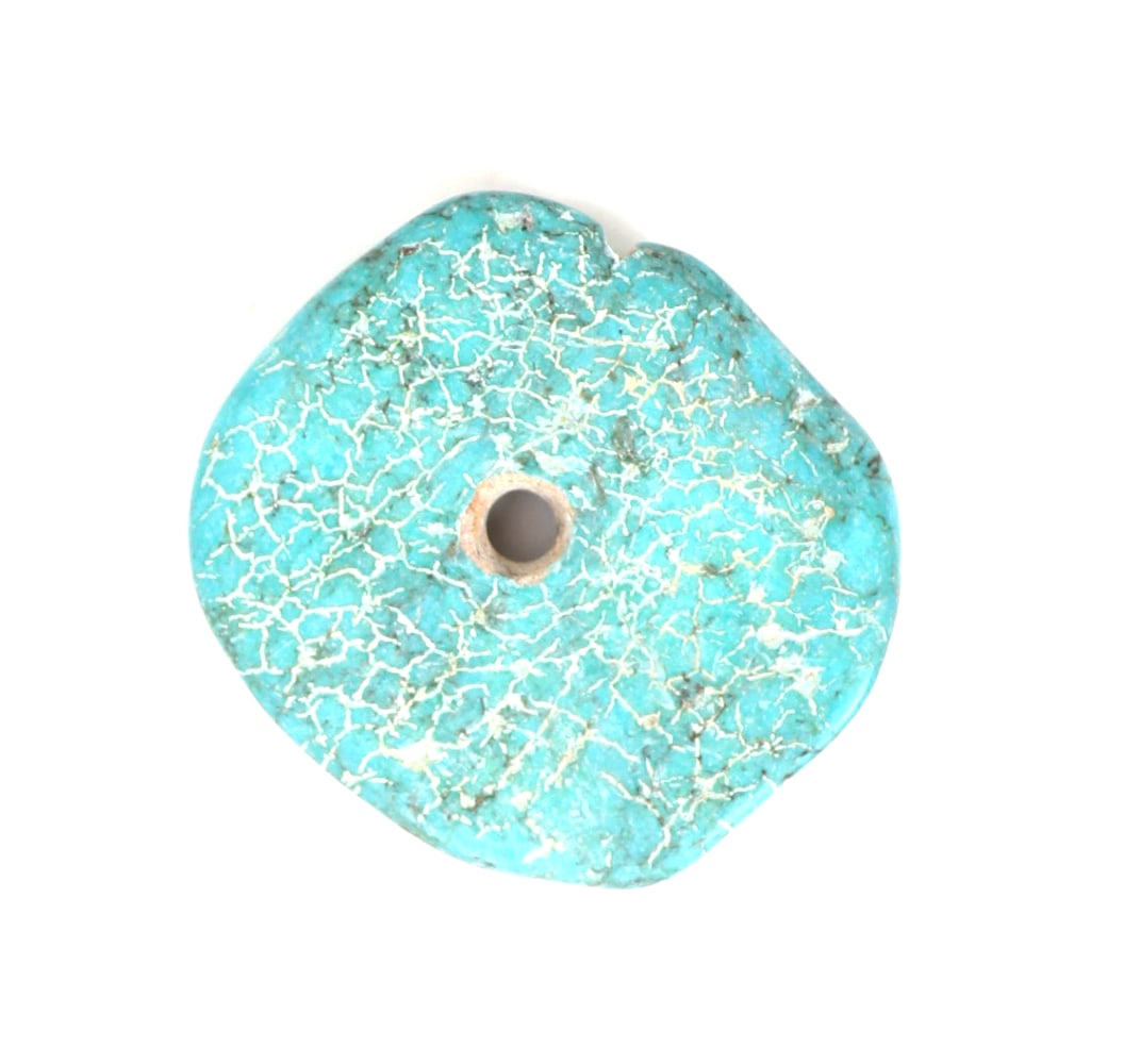 Nicely Shaped Raw Turquoise Disc Pendant, 47 Grams: Lovely raw turquoise mineral section shaped into a pendant, drilled to the center for easy suspension with earth roots throughout. Size 47 grams, 2 1/4" W
