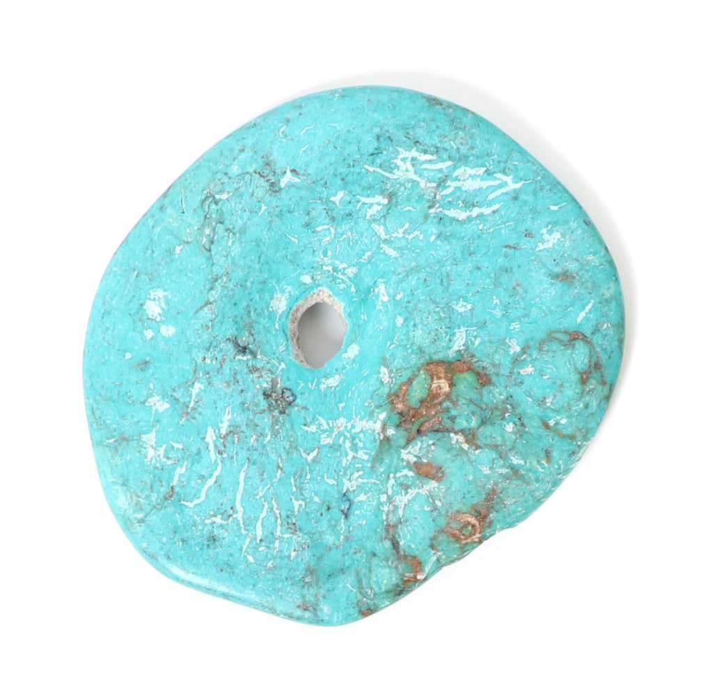 Lovely Raw Turquoise Disc Bead Pendant: Natural raw bright turquoise disc pendant drilled to the center for easy suspension. Natural earthen root marks throughout. Size 2 3/4" W, 44 grams