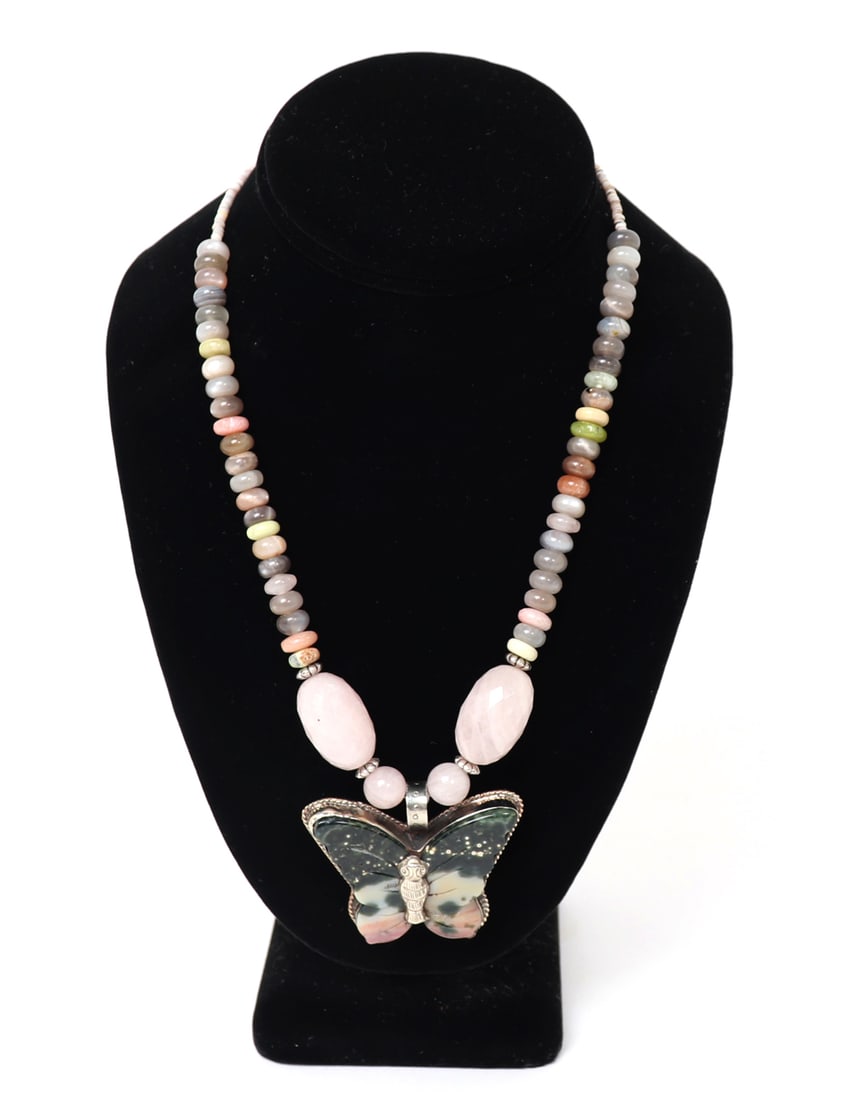 Stunning Rhodonite & Multi-Gem Butterfly Necklace: Wonderful natural raw Rhodonite butterfly perfectly shaped into a beautiful butterfly. Surrounded by dozens of precious gem stones throughout, with beautiful coral and shell beads at the clasp. Size