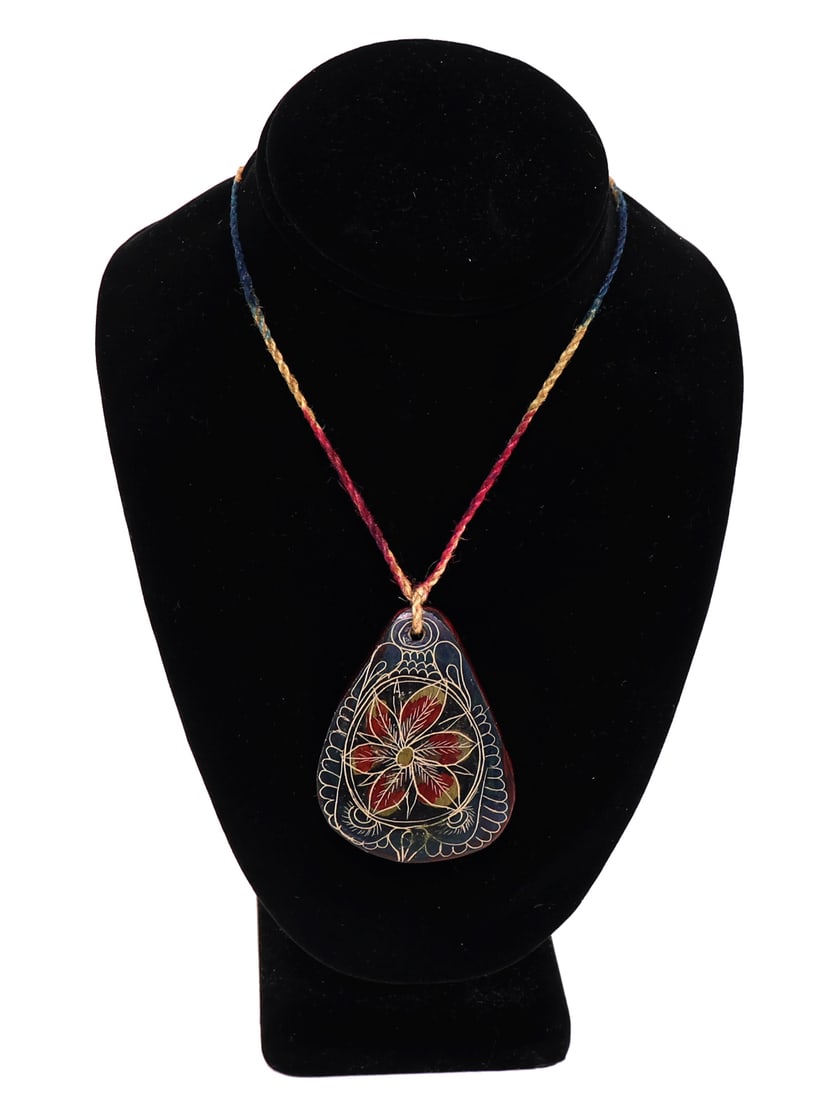 American Indian Carved Polymer Clay Pendant: One of a kind hand carved dual sided polymer clay pendant. Featuring stunning bloomed flowers on each side with a rainbow cord. Painted petals in red, green and orange - with lovely iridescence to