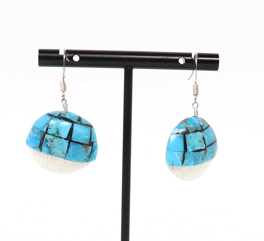 Turquoise Overlaid Seashell Earrings: Lovely pair of turquoise overlaid on seashell drop earrings, with sterling silver hooks. The turquoise has been polished to make for a smooth surface throughout. Size 1 3/4" L