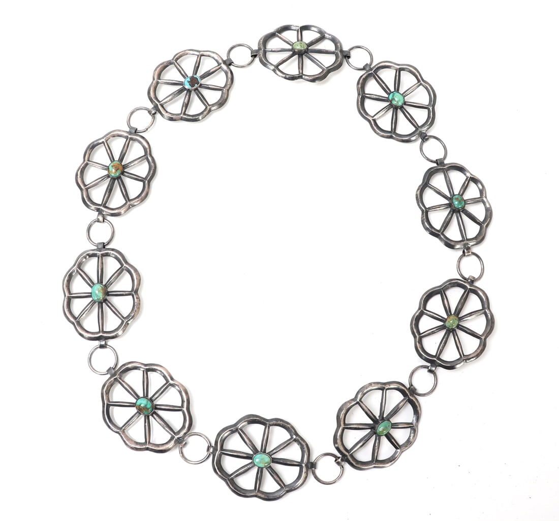 Beautiful Native American Turquoise Belt: Lovely silver and turquoise Native American concho belt. Ten individual turquoise cabochons, affixed to the face of each lovely belt buckle, shaped in a wonderful six petal flower pattern. Size 33 1/2