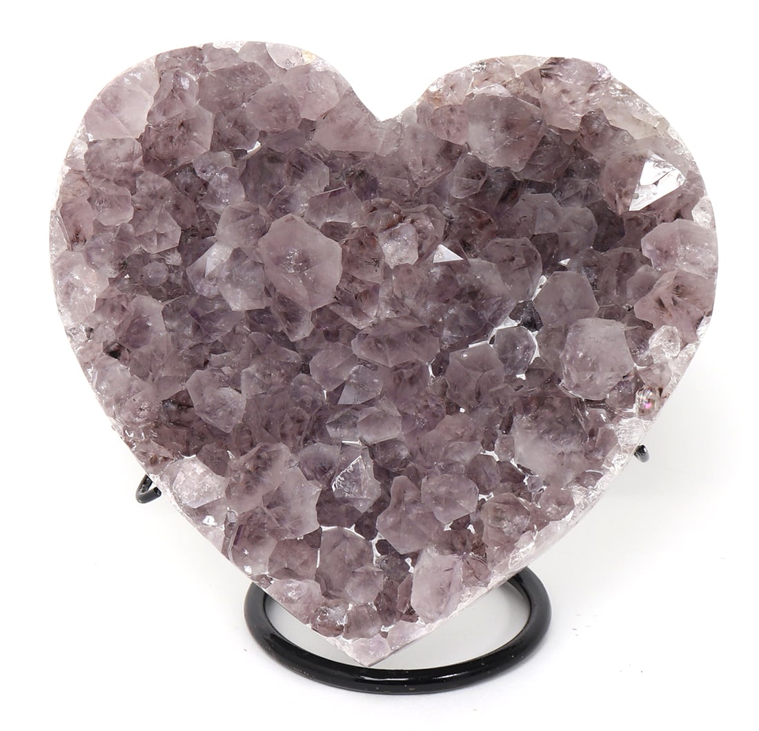 Lovely Amethyst Geode Carved Heart: Dozens of terminating crystals cover the face of this lovely amethyst geode, left raw on the reverse, polished smooth around the edges, and proudly displayed on a custom stand. Size 6" H, includes