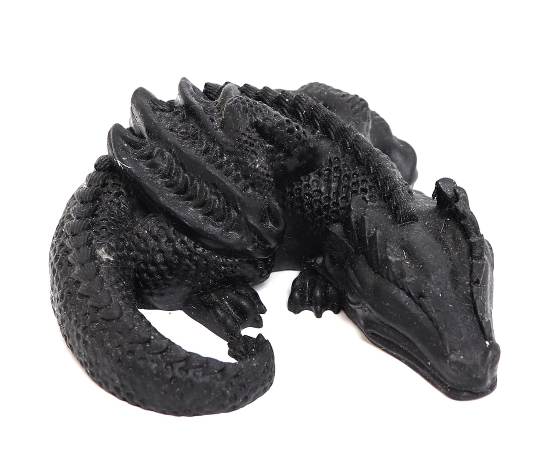 Recumbent Natural Black Tourmaline Dragon: Comprised of natural raw crushed tourmaline and shaped into a handsome recumbent dragon. Heavily detailed throughout with scales, wings and a long snout. Size 4" W