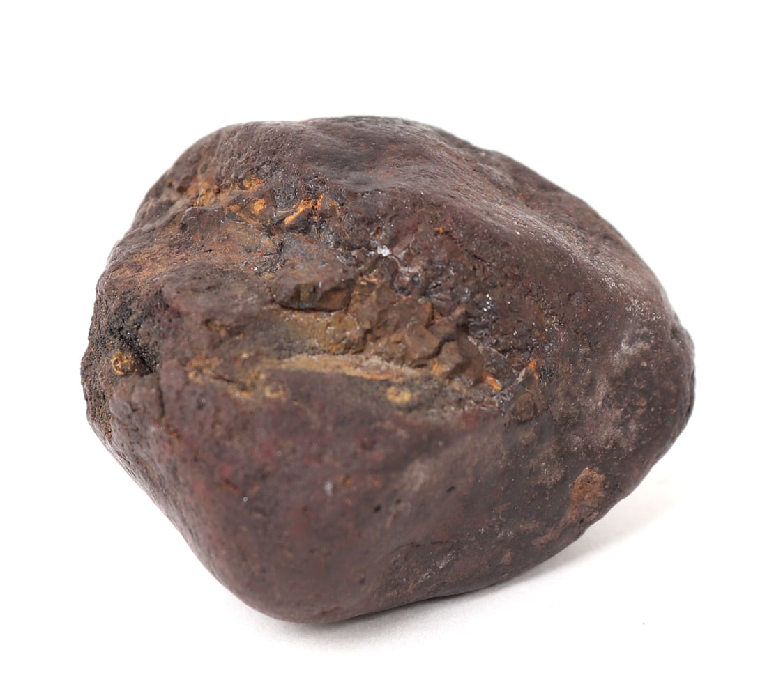 Ancient Meteorite Specimen, Oregon: Wonderful ancient meteorite specimen with a smoothed surface from years of being underground after landing uncountable years ago. Beautiful red almost rust colored patina throughout. Size 1 3/4" W, 20